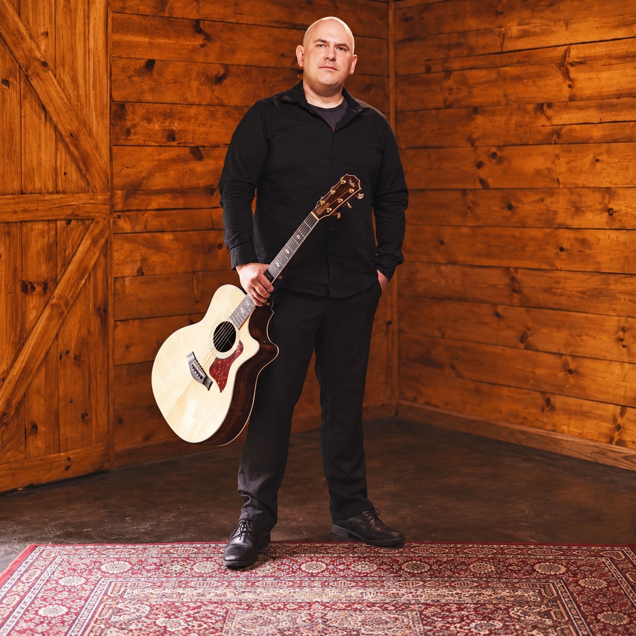 Ben McMunn with his acoustic guitar